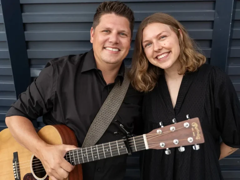 Live music duo performing at a commercial real‑estate event in Minneapolis MN, captured by UAV Vision Media – immersive entertainment, corporate networking scene, Twin Cities venue