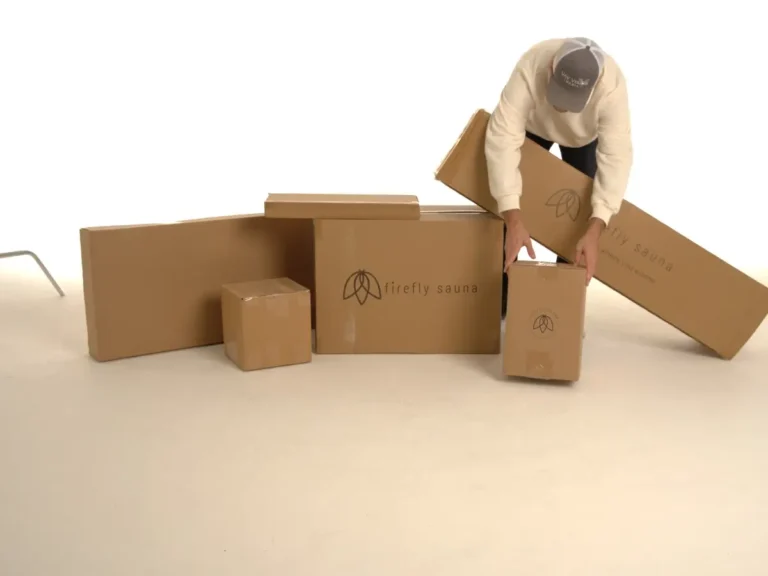 Clear, trust-building view of Firefly Sauna product packaging laid out before assembly in Minnesota, showcasing organized components, completeness, and premium presentation—photographed by Chris Blaeser of UAV Vision Media, a trusted local Native American photography company.