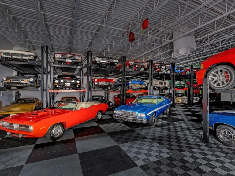 Emotion-filled view of classic vintage cars illuminated under showroom ceiling lights in Minnesota, showcasing polished finishes and timeless automotive design—captured by Chris Blaeser of UAV Vision Media, a trusted local Native American photography company
